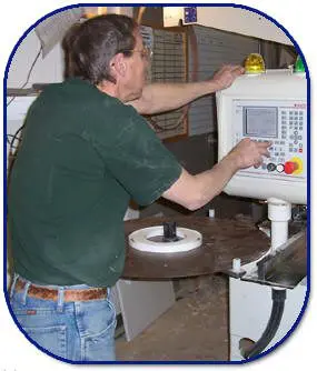 A man working on an electronic device.